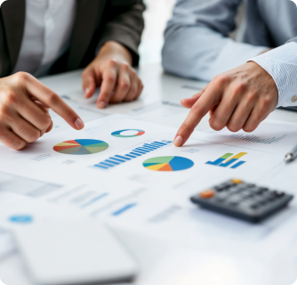A printed business report featuring various colorful pie charts and bar graphs on a desk.